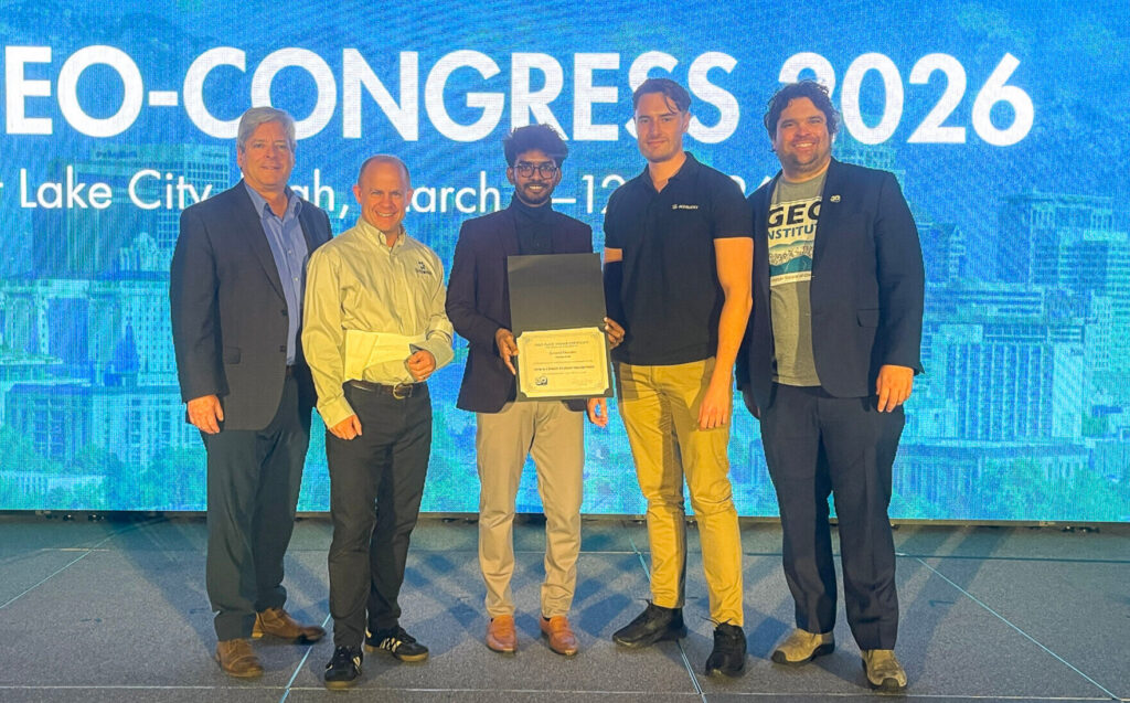 2026 DIGGS Hackathon winner accepts his award.