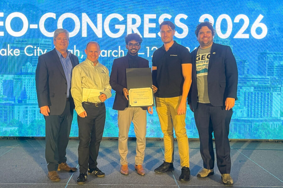 2026 DIGGS Hackathon winner accepts his award.