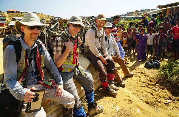  Above: Eric Johnson with an IPAD for navigating through the Kutupalong Expansion Camp, Alastair McClymont and Colin Miazga with 40 kilogram ERT cable reels on their backs, and Chris Slater, all taking a rest during the 1 hour hike out of the Kutupalong camp. 