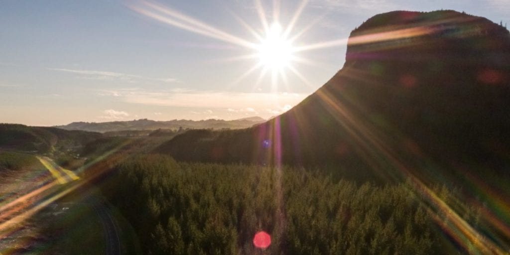 sun rising over a mountain