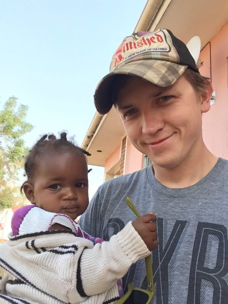 Franklin Koch and Tina, the child of a cook working with the team