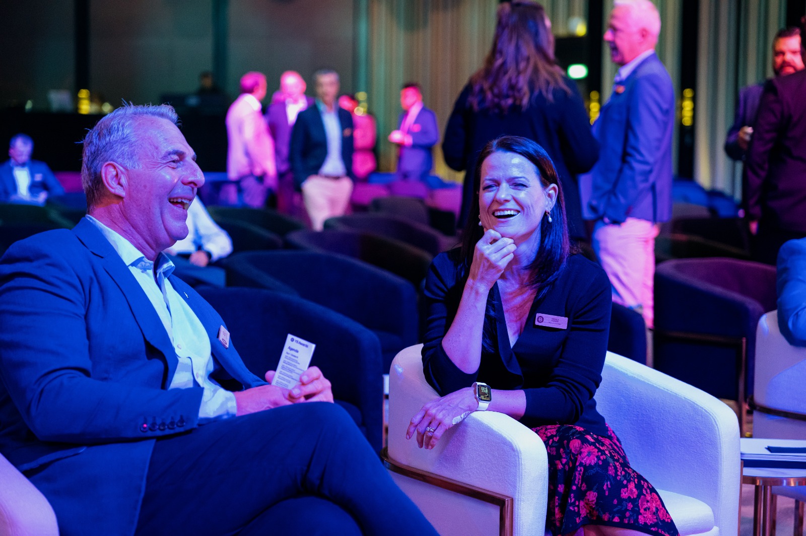 A photo taken of two people at the Bentley YII awards, both laughing. Seequent's Chief Customer Officer Angela Harvey at Year in Infrastructure 2026.