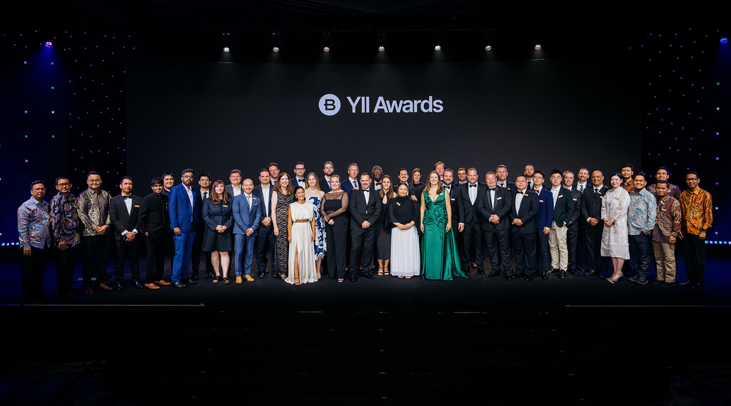 ward winners from all 12 categories stand together on stage beneath a YII Awards sign at the 2026 Year in Infrastructure Awards ceremony in Singapore.