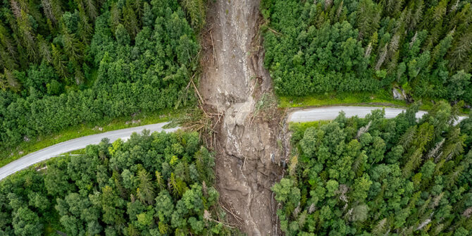 Aerial photo of landslide across forested road