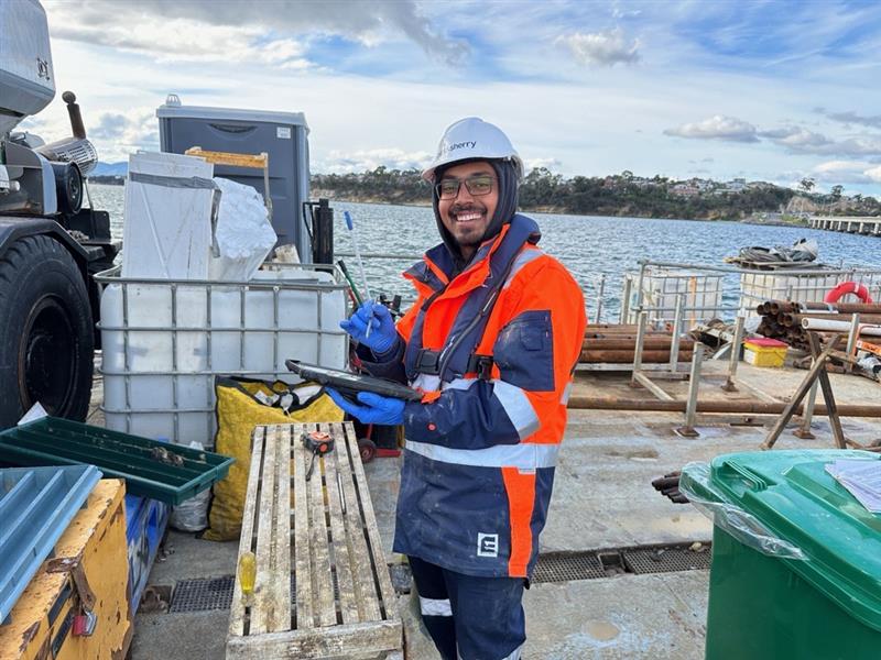 a photo of a team member from pitt&sherry's collecting data.