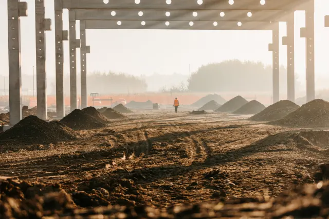 Frame structure at under construction site on rural landscape. Getty Images 1316316537.