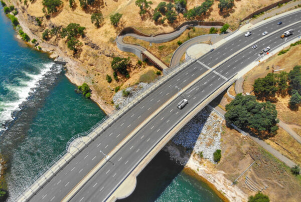 A photo of a bridge over water and land