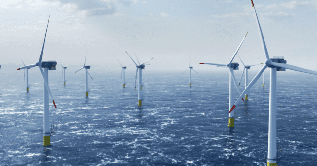 A picture of offshore wind power and energy farm with many wind turbines on the ocean