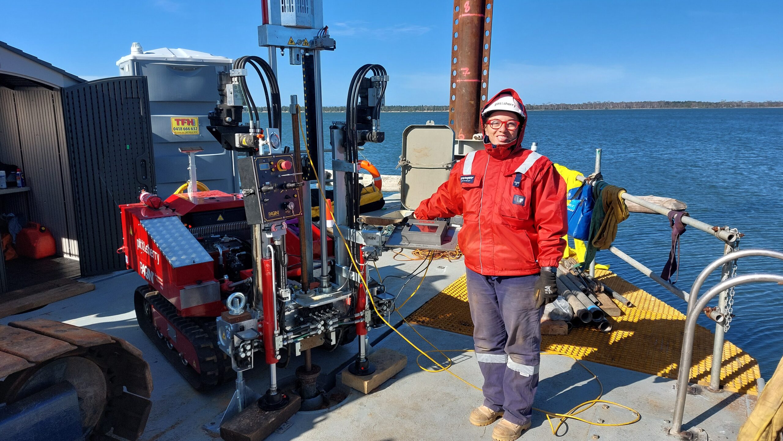 a photo pf am engineer from pitt&sherry's team out in the field - on a boat in the ocean.
