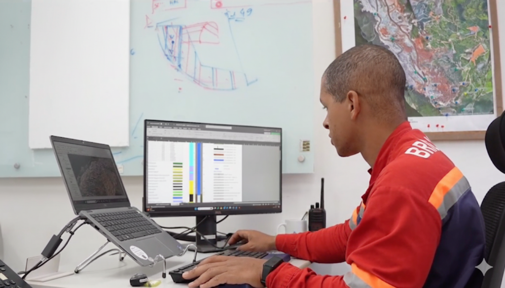 a photo of an anglo american employee at their desk using seequent software