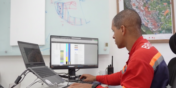 a photo of an anglo american employee at their desk using seequent software