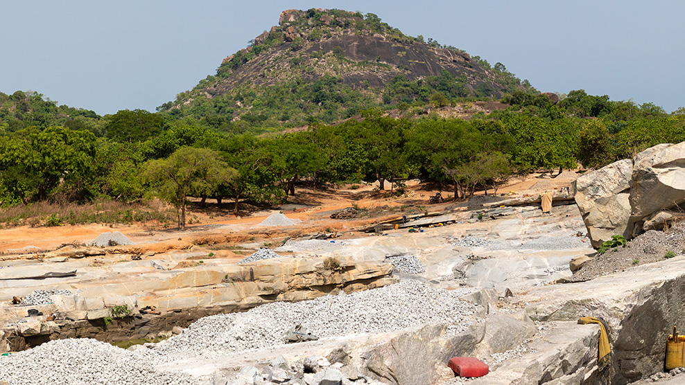 Work under way in a Côte d'Ivoire granite quarry.