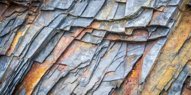 Natural patterns in the rocks at a beach in Pembrokeshire. The coast was quarried for slate many years ago. The rocks contain rust and other minerals which give the pattern a wonderful colour. The image was taken at Abereiddy beach right on the coast in the Pembrokeshire National Park.