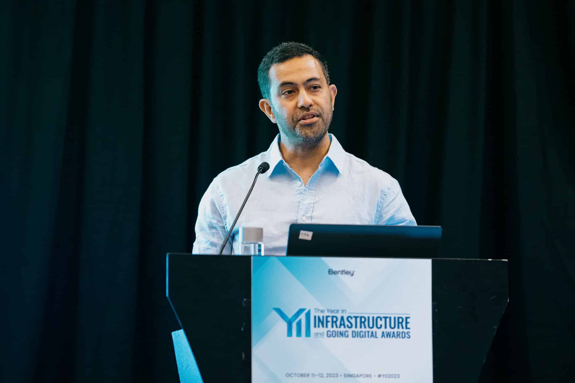 A photo of OceanaGold's Andre Alipate, Senior Engineer speaking at Bentley's YII Going Digital Awards 2023
