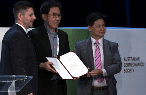 A picture of Eddy Tan (centre) Seequent's Sales and Channel Director Asia receives the Oustanding Innovation award on behalf of the PLAXIS team.