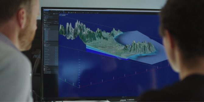Seequent staff look at a 3D model in Central