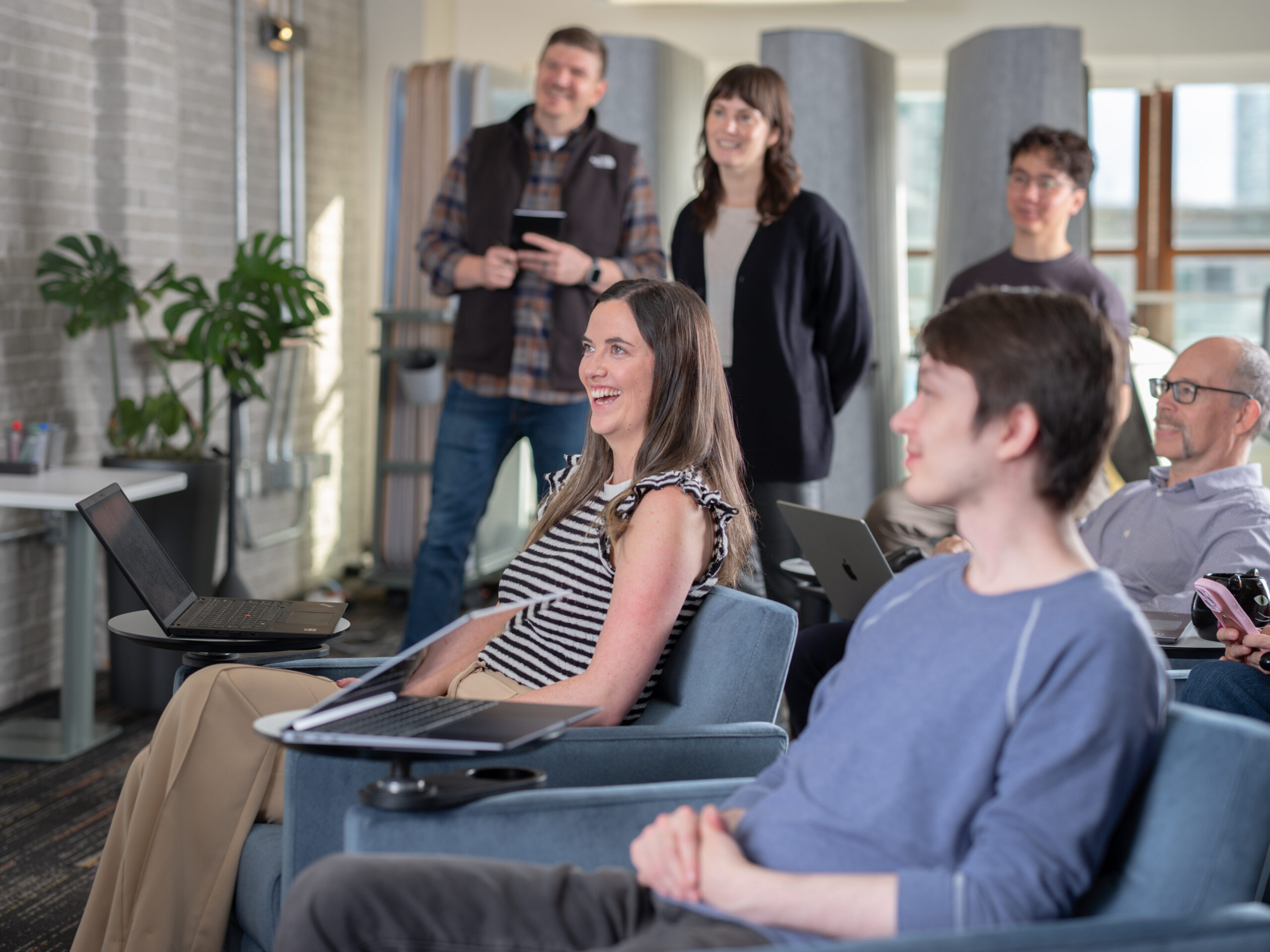 Seequent employees in the Vancouver office engaging in a meeting