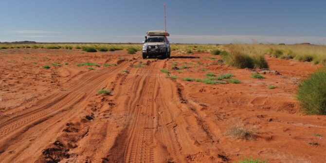 photo of a 4wd on a desert track