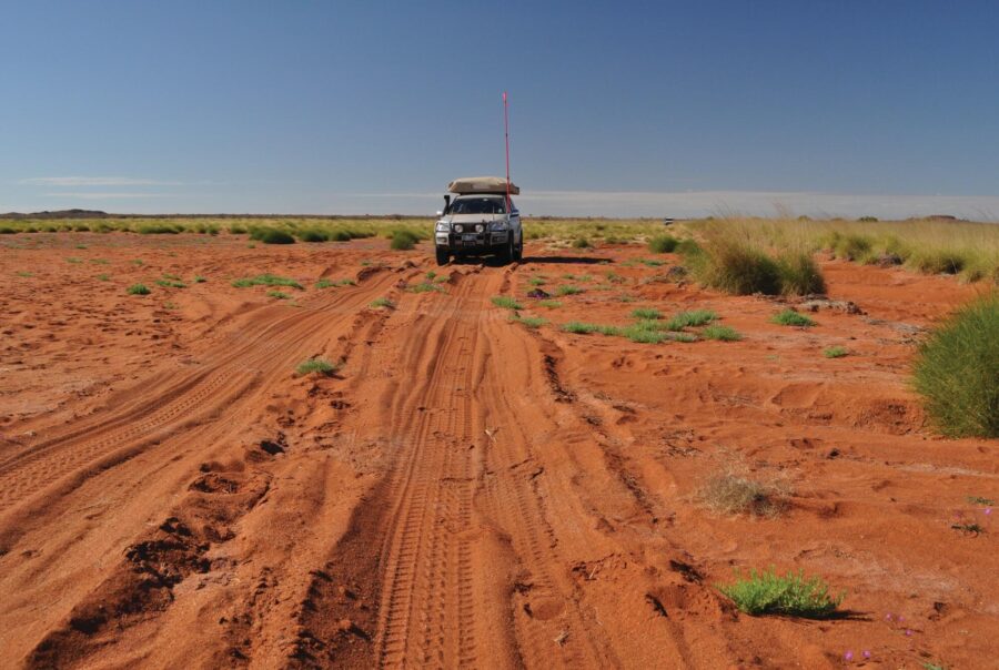 photo of a 4wd on a desert track