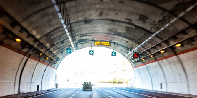 an out of focus photo of a car driving through a tunnel