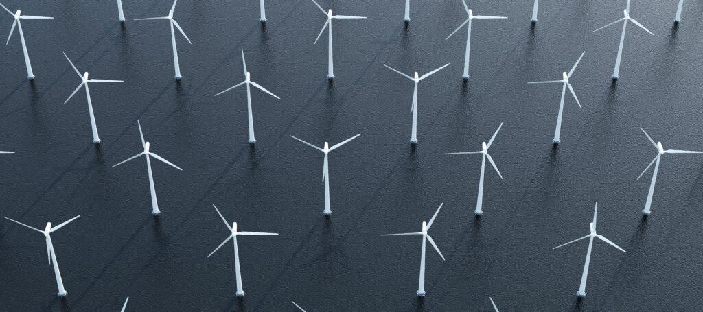 Aerial view of modern wind turbines plant in the sea.